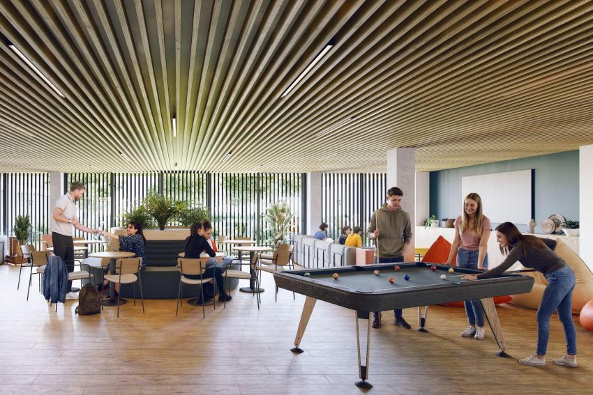 Common area of a student residence in Zaragoza with pool table and study space